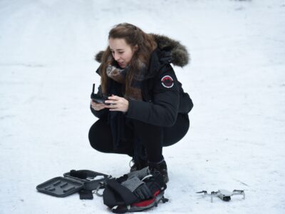 Erin with photo equipment in the snow